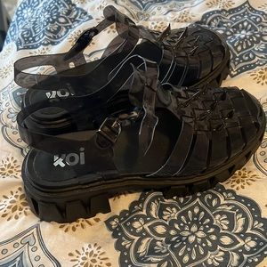Black Strapped platforms